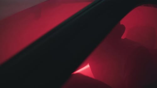 Silhouette of Angry Man Raising Fist in Car