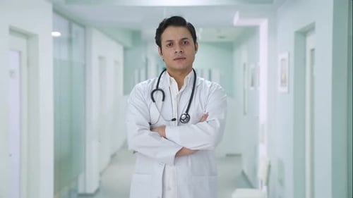 Male Doctor With Stethoscope In Hospital