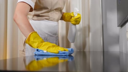 Cleaning Office Desk With Antibacterial Disinfecting Wipe