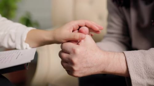Comforting Hands in Gentle Act of Support