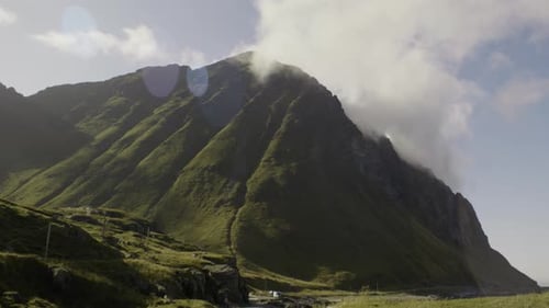 Dramatic Mountains Reach into Cloudy Blue Sky