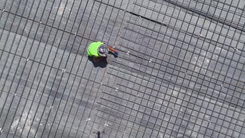 Aerial View Construction Workers Preparing the Floor and Bending Rebar for Future Stages