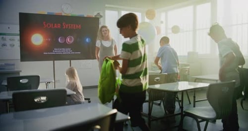 Elementary Students Gathering Belongings in Classroom after School