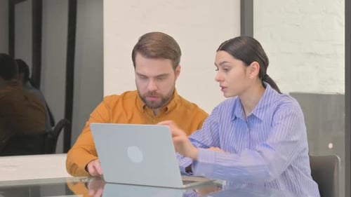 Excited Business People Celebrating Success in Office