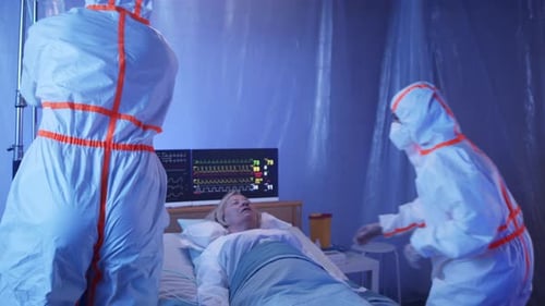 Doctors and Covid-19 Patient with Oxygen Mask in Bed in Hospital, Coronavirus