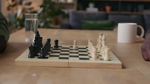 People Play Chess in Cozy Home Setting