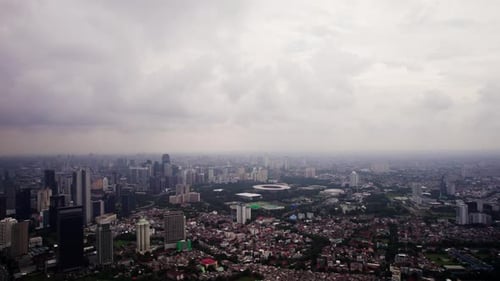 Aerial View Over Capital of Indonesia Jakarta Showing Concrete Jungle and High Rise Buildings