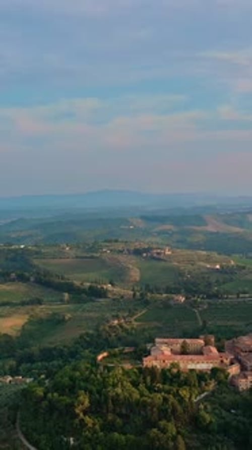 Aerial Panning Wide Shot of San Gimignano and Valley Tuscany Italy