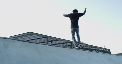 Man, skateboard and sport in park outdoor for fitness, freedom and training with action and sky