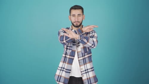 Man Gesturing Against Blue Background