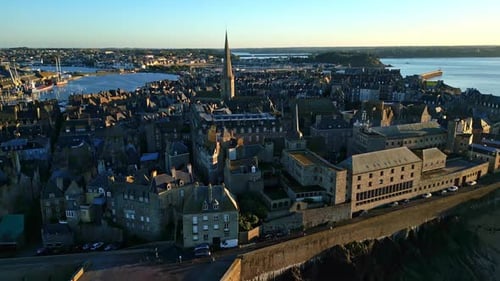 Saint-Malo Intra Muros historical town center at sunset, Brittany in France. Aerial forward