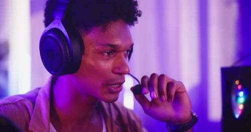 Young Adult Gamer with Headphones