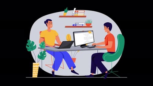 Two people collaborating at a modern workspace.