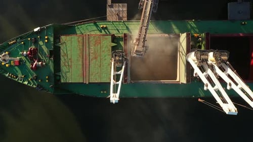 Aerial View Fom Above Wheat Loading to Bulker Ship Cargo Hold at Sea Grain Elevator in Sea Port
