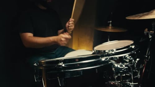 Expressive Drummer Young Man Professionally Playing on Dums in Studio Room Closeup Rock Metall Music