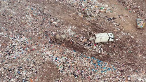 Aerial Drone View of Landfill with Garbage Trucks and Waste Piles Environmental Pollution Waste