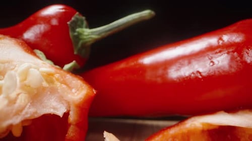 Chopped sweet red pepper. Dolly slider extreme close-up.
