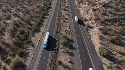 Aerial view of winding road through desert landscape, United States.