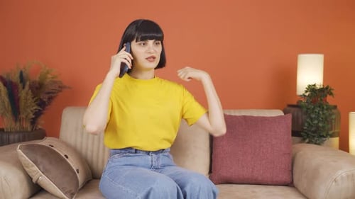 Angry woman talking on the phone.