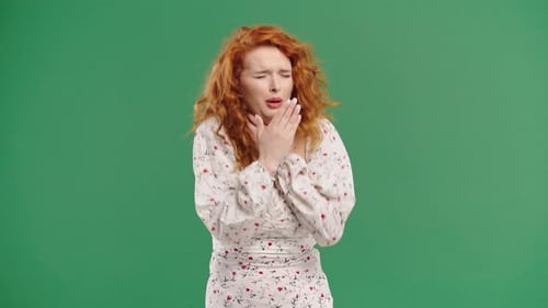 Fieryhaired Woman Has Sore Sick Lady Swollen Throat On Green Studio Angina