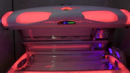 Tanning Bed with Red and Purple Lights