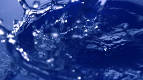 Abstract Shot of Blue Water Splashing with Bubbles
