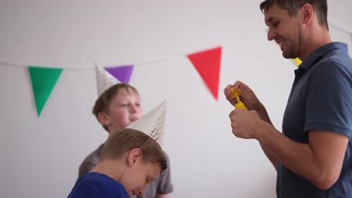 Family Celebration with Boys Blowing Bubbles