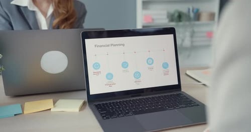 Asia businesswomen using laptop on table working and communicate sitting on office desk.