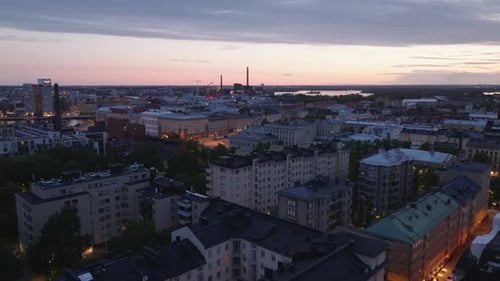 Evening Aerial View of Cityscape with Warm Lights