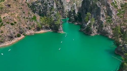 Aerial View Paddleboarding Fun in the Large Green Canyon People Swimming and Relaxing