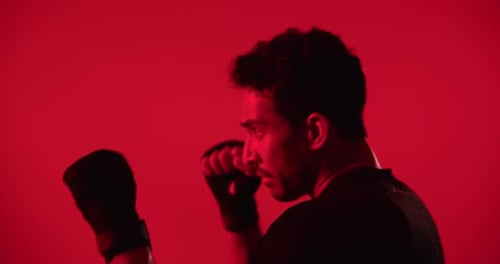 Fitness, boxing and man in studio for workout, self defense or training for competition with active