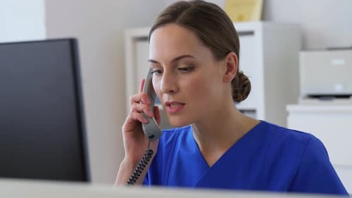 Female Doctor on Phone in Office
