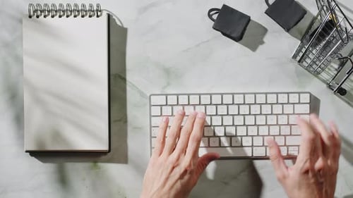 Hands Typing on Keyboard, Overhead View