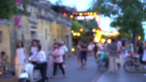 Blurry shot of Hoi An town street full with toursts