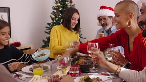 Family Celebrates Christmas with Festive Dinner at Home