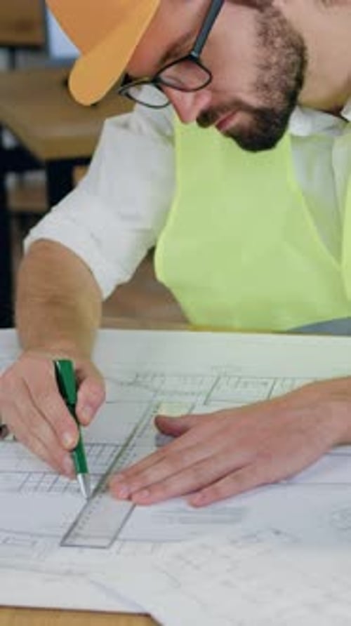 Engineer Drawing Construction Plan Blueprint with Ruler and Pencil