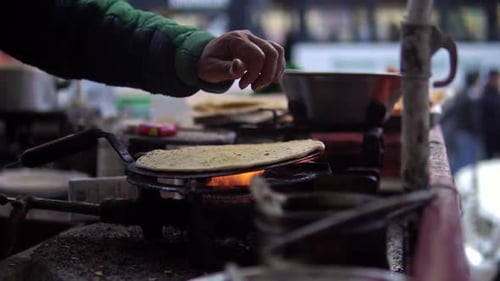 Aloo paratha, a popular dish in north India being prepared by a street vendor near Shimla, India.