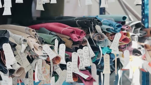 Assorted Colorful Fabrics Stored Neatly on Shelves