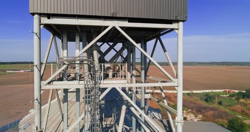 Granary grain elevators. Metal tanks for the storage crop. Large bins for farming.