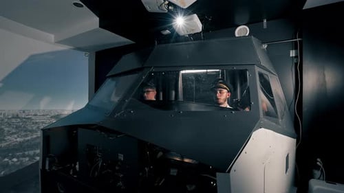 young pilots in the cockpit of the plane control air transport during long distance flight simulator