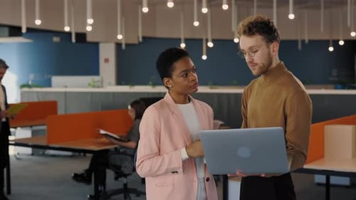 Colleagues Working Together in Modern Office Environment