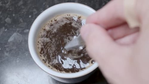 Stirring a Cup of Coffee, Close Up