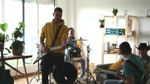 music band rehearsing in the studio with electric instruments