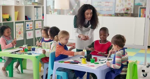Teaching, children and painting in classroom, woman and education for group in daycare and students