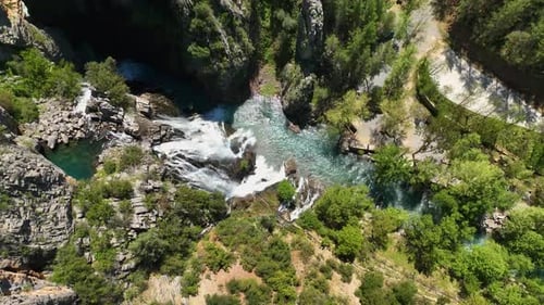 Above the Cascades AweInspiring Aerial View of a Picturesque Waterfall