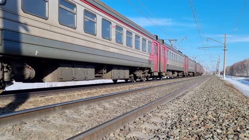 Passenger train over railroad track passing by in winter, Trans-Siberian Railway
