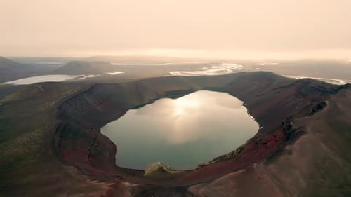 Aerial View of Iceland Ljotipollur Crater Water Filled Caldera at Sunset. Drone Circles Around Epic
