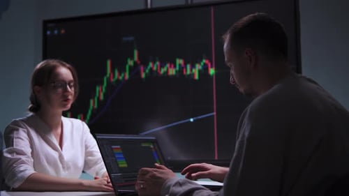 Trader and His Colleague Trade on the Stock Market in Their Office