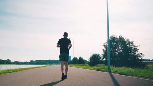 Runner Run Active Confident Hardy Man Running Back View Daylight Sunny Hot Morning Endurance Cardio
