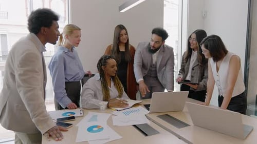 A Diverse Business Team Working Together in a Bright and Modern Office Environment